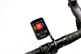 Bicycle computer mounted on a bike handlebar with a white background