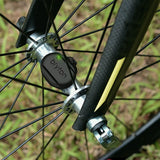 Bicycle wheel with a Byron brand hub on a blurred green background