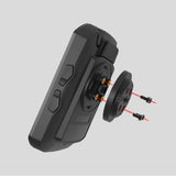 Black electronic device with a detachable component on a gray background