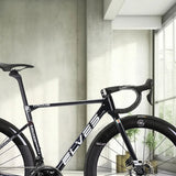 A black Elves Vanyar PRO Disc road bike frameset with aerodynamic design, displayed in an indoor setting.