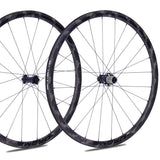 A pair of OROME Valar carbon wheelsets with ceramic bearings, featuring a grooved brake surface technology and a zero-coating finish on the rims.