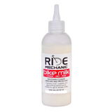 Bottle of Ride Mechanic bike chain lube on a white background