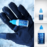 A gloved hand holds a small bottle of Squirt Chain Lube, with two smaller inset images on the right showing the bottle label and cap against a light background.