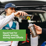 Person pouring Skratch Labs energy drink mix into a shaker bottle with text about energy during hard efforts.