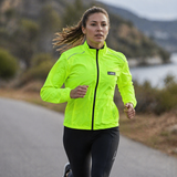 Woman running on a road with a scenic background