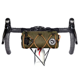 Green waist bag with black straps on a white background
