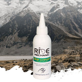 Bottle of Ride product with a mountainous landscape in the background