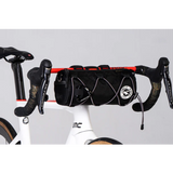 Bicycle with a black bag attached to the handlebars on a white background