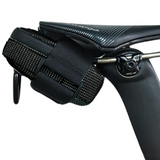 Close-up of a black bicycle handlebar with a glove on a white background