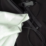 Close-up of a black bag with a white fabric inside