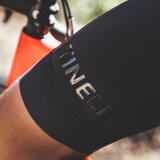 image of person wearing a pair of Tineli Men's Cycling Bibs while sitting on a bike